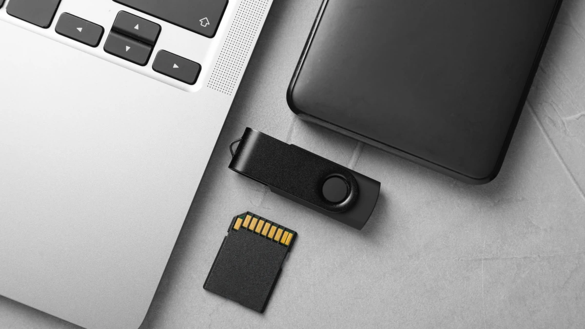 Laptop with USB drives and SD cards for data storage
